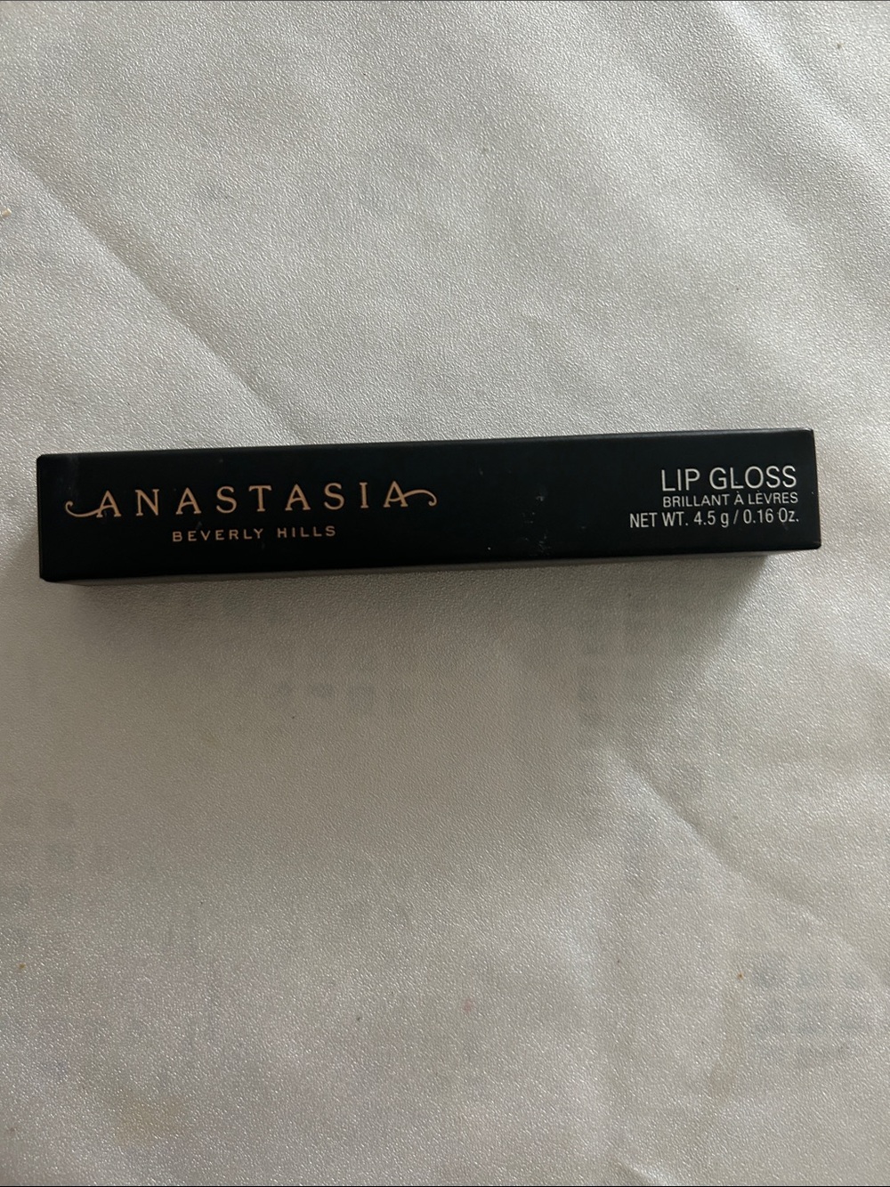 Anastasia Beverly Hills Lip Gloss in Black with Rose Gold Logo
